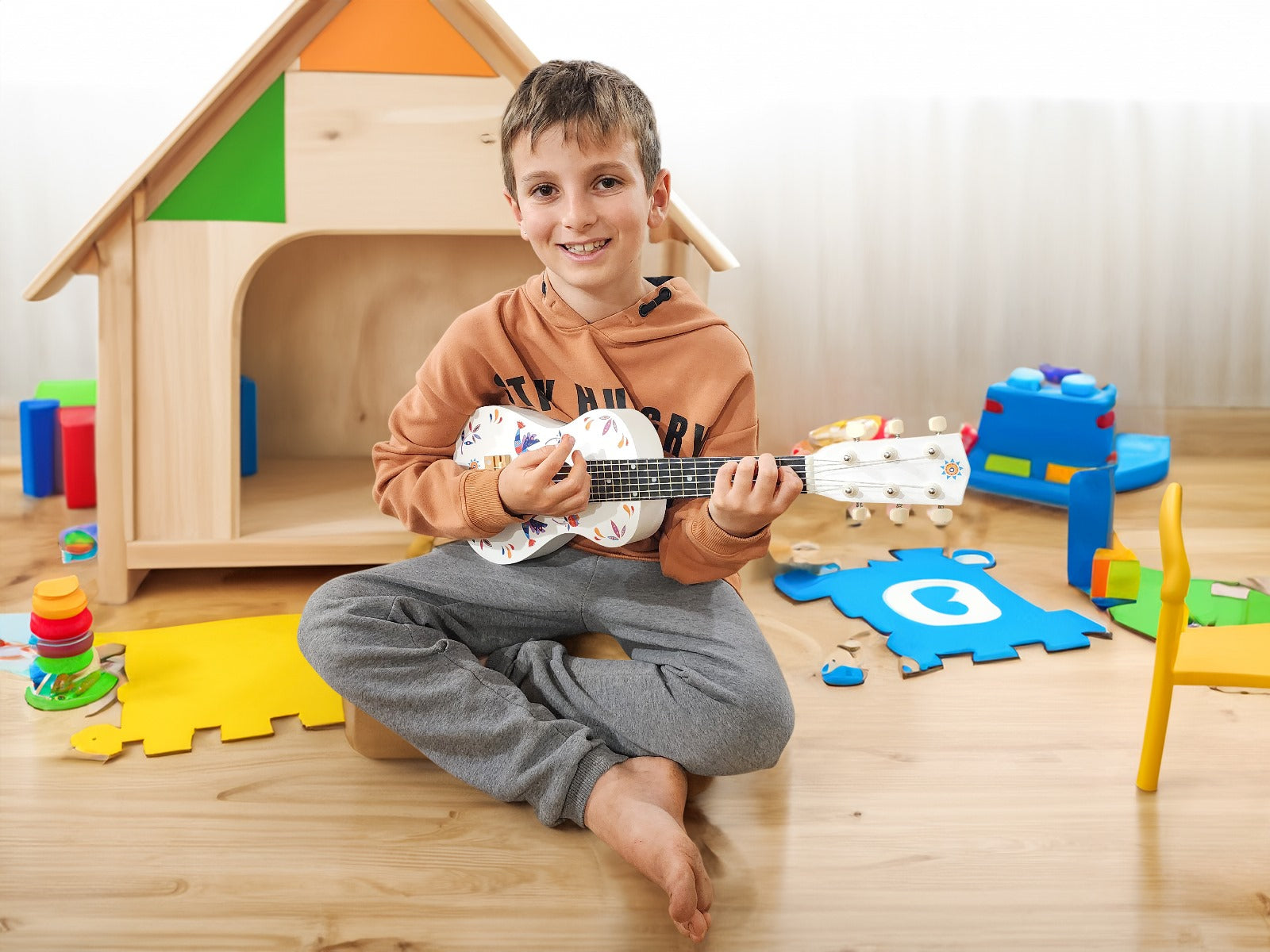 Children’s Wooden Guitar by Marmelada Music.